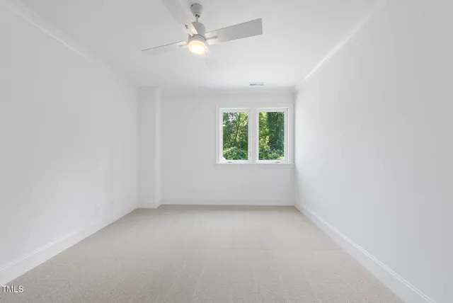 an aerial view of a house with a garden