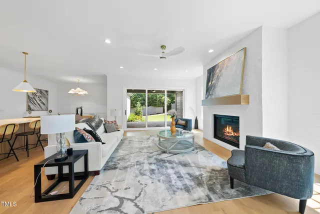 an empty room with windows and cabinet