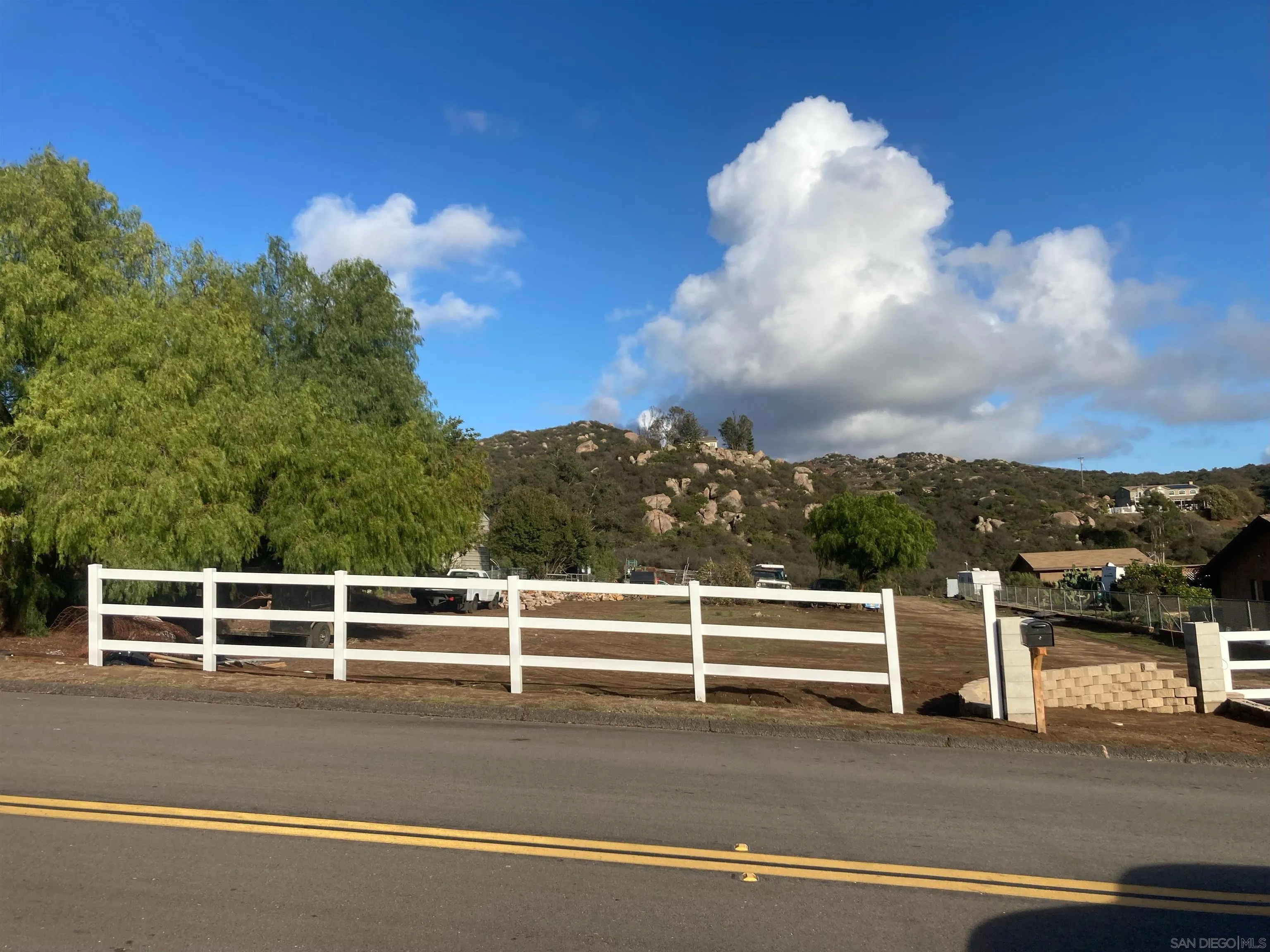 10041 Dunbar Lane, Unit 1 El Cajon, CA 92021 - Photo 2 of 14 a view of a white house with a yard