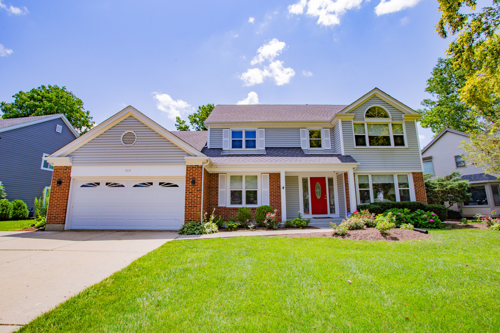608 Raintree Road Buffalo Grove, IL 60089 - Photo 1 of 59 a front view of house with yard and green space
