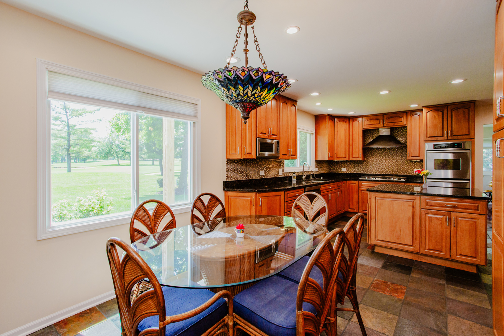 608 Raintree Road Buffalo Grove, IL 60089 - Photo 27 of 59 a view of a dining room with furniture window and outside view