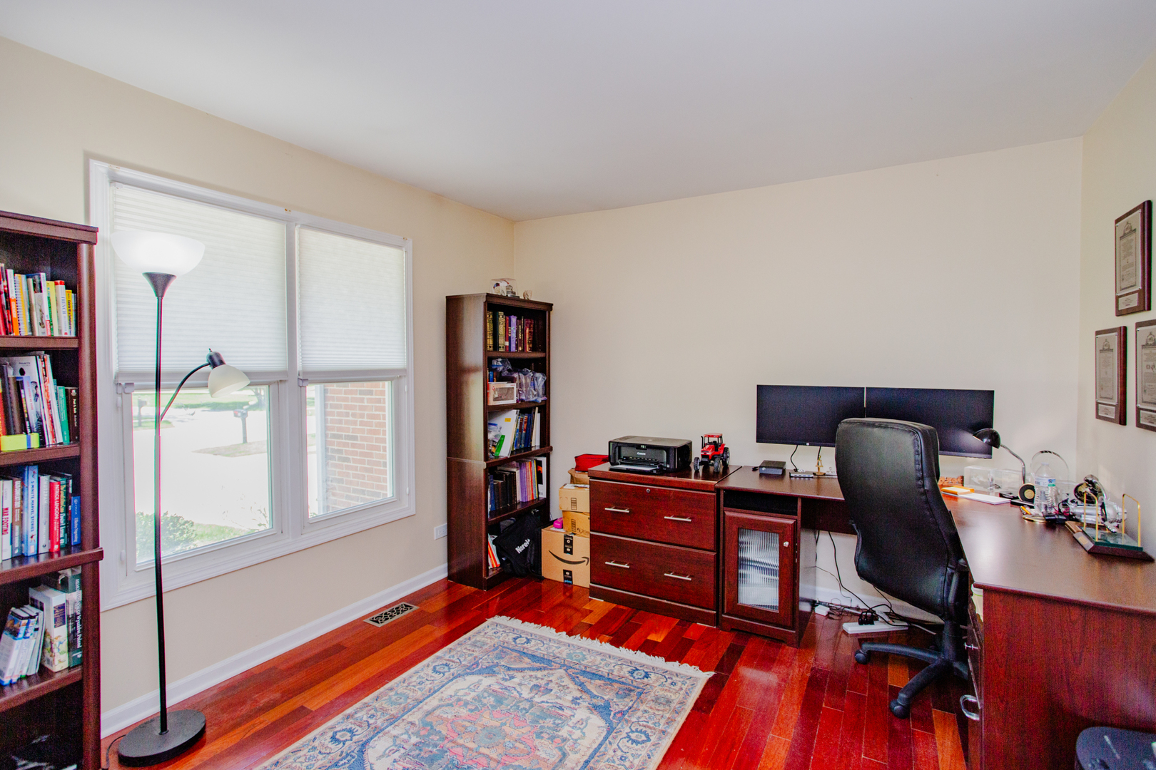 608 Raintree Road Buffalo Grove, IL 60089 - Photo 29 of 59 a view of a workspace with furniture and a window
