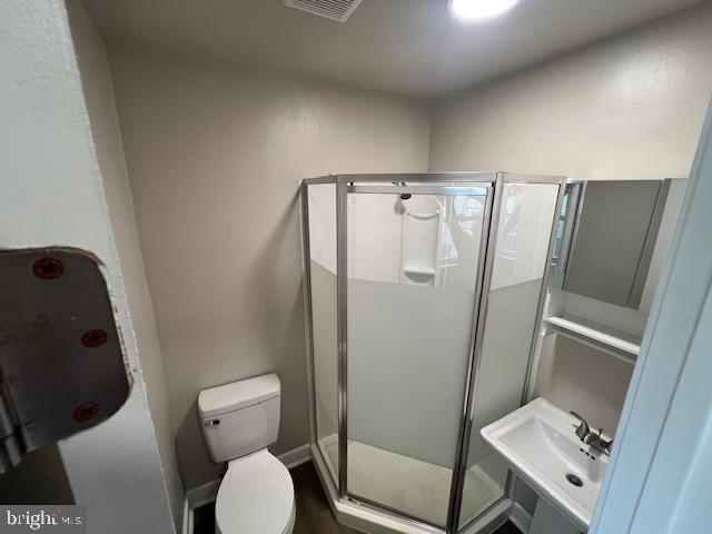 1410 Colchester Road Woodbridge, VA 22191 - Photo 11 of 19 a bathroom with a toilet and a shower
