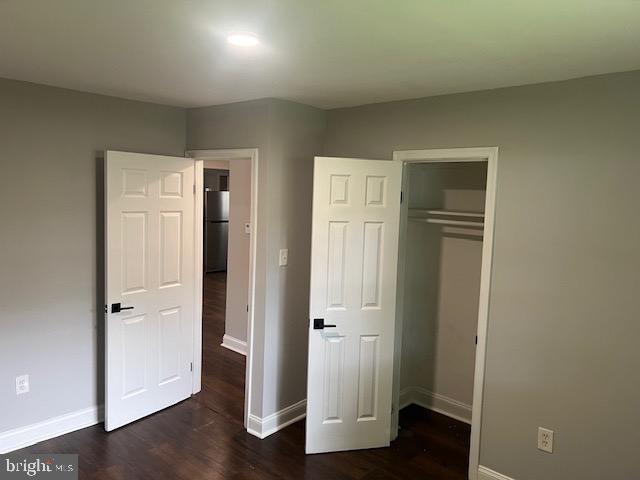 1410 Colchester Road Woodbridge, VA 22191 - Photo 12 of 19 an empty room with wooden floor and closet
