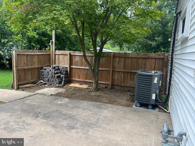 1410 Colchester Road Woodbridge, VA 22191 - Photo 16 of 19 a backyard of a house with barbeque oven and outdoor seating