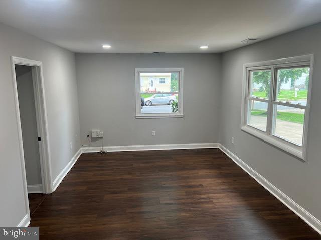 1410 Colchester Road Woodbridge, VA 22191 - Photo 4 of 19 an empty room with wooden floor and windows