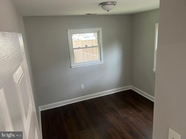1410 Colchester Road Woodbridge, VA 22191 - Photo 6 of 19 an empty room with wooden floor and windows