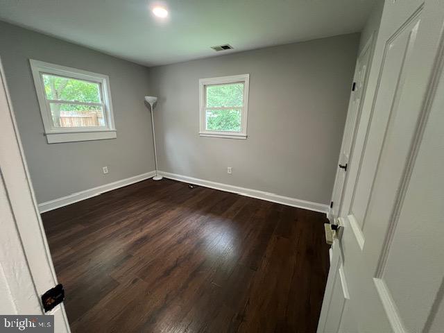 1410 Colchester Road Woodbridge, VA 22191 - Photo 9 of 19 an empty room with wooden floor and windows