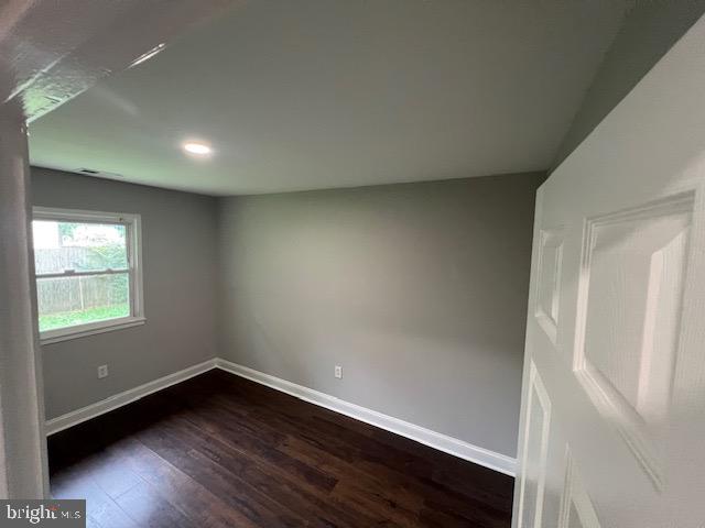 1410 Colchester Road Woodbridge, VA 22191 - Photo 10 of 19 an empty room with wooden floor and windows