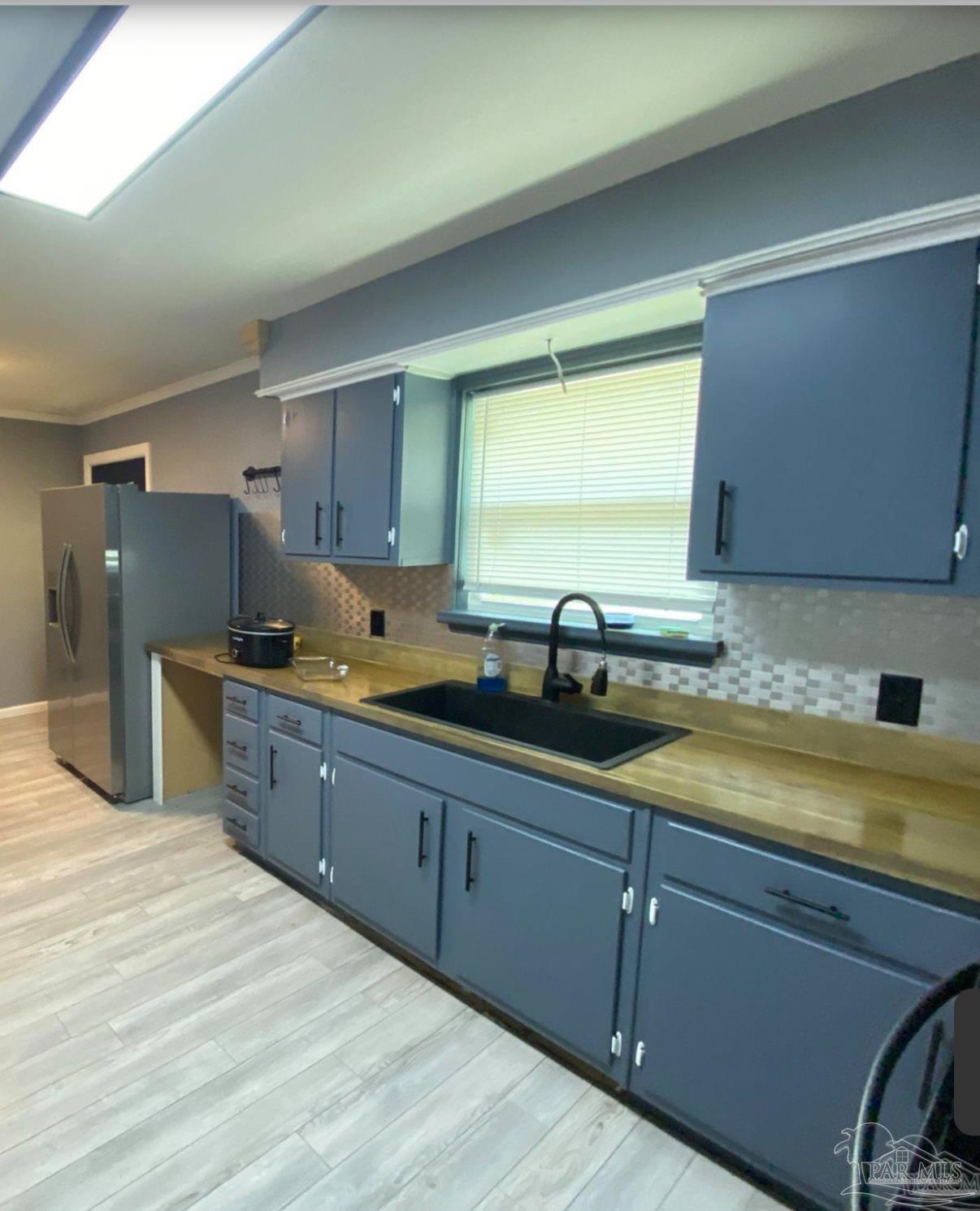 902 Decatur Avenue Pensacola, FL 32507 - Photo 10 of 10 a kitchen with sink and cabinets