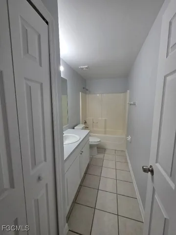 a bathroom with a sink a toilet and a shower