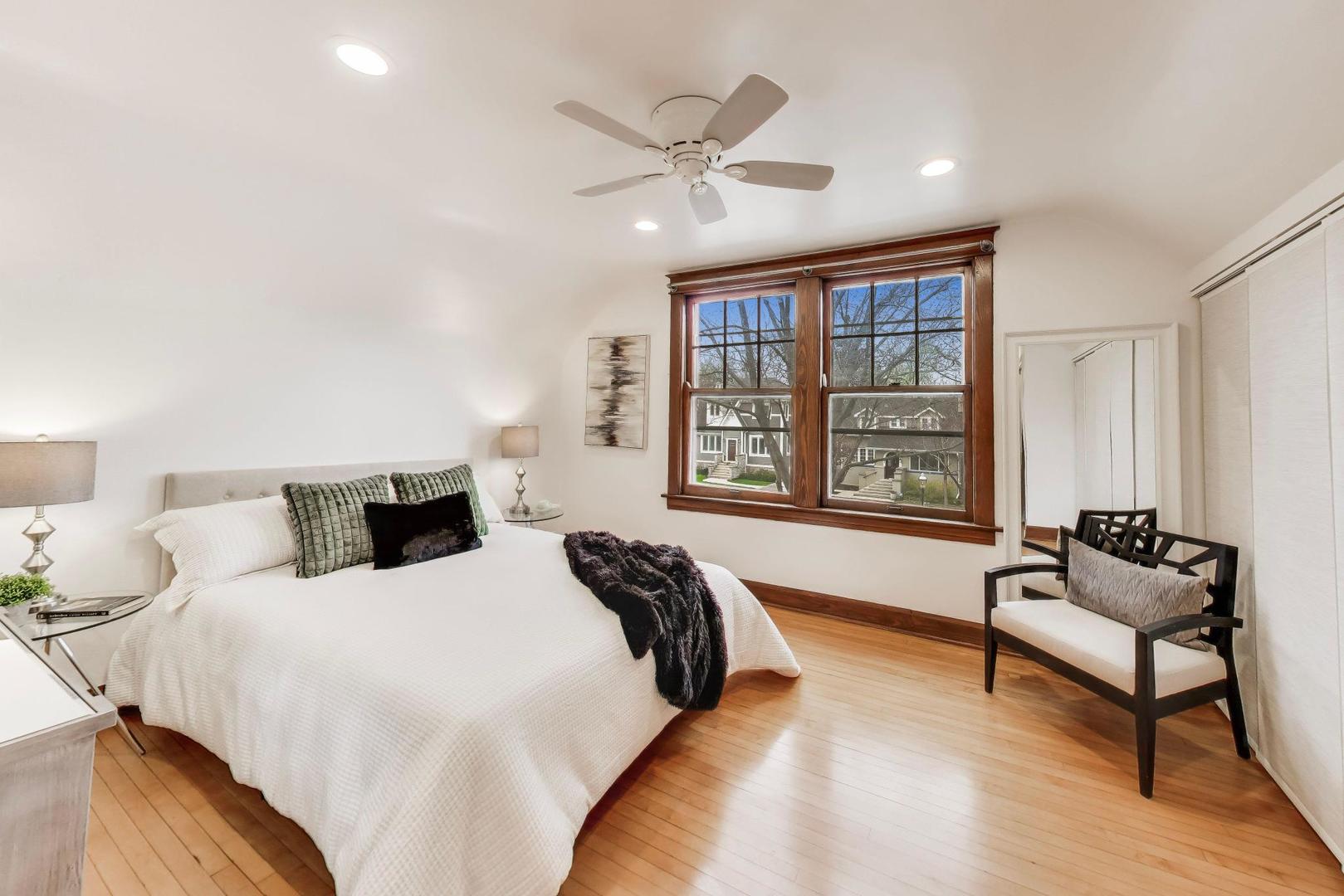 256 Blackhawk Road Riverside, IL 60546 - Photo 26 of 73 a spacious bedroom with a bed and a window