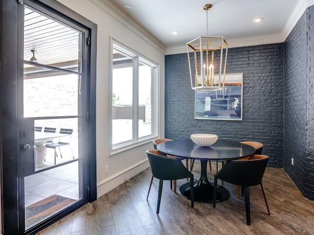 4805 116th Street Lubbock, TX 79424 - Photo 12 of 57 a view of a dining room with furniture window and wooden floor
