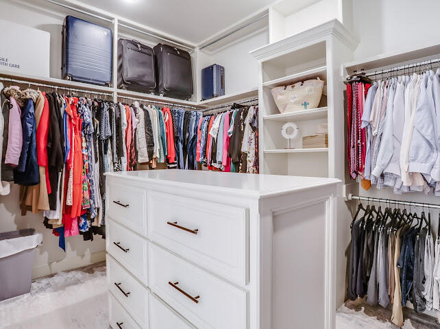 4805 116th Street Lubbock, TX 79424 - Photo 21 of 57 a view of walk in closet with clothes