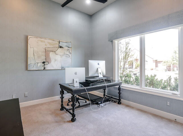 4805 116th Street Lubbock, TX 79424 - Photo 29 of 57 a view of a workspace with furniture and a window