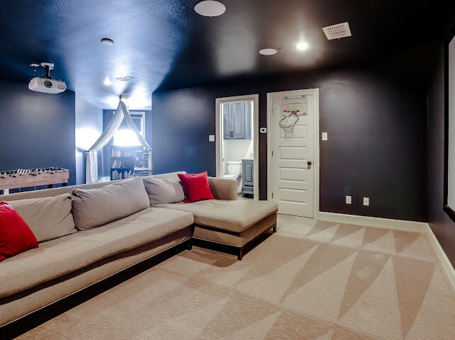 4805 116th Street Lubbock, TX 79424 - Photo 34 of 57 a living room with furniture and a chandelier