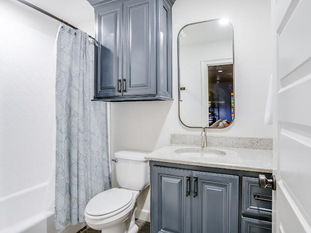 4805 116th Street Lubbock, TX 79424 - Photo 36 of 57 a bathroom with a sink a toilet and shower