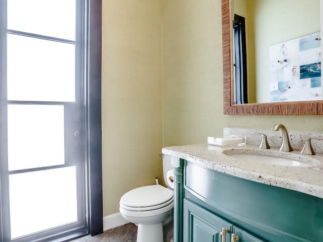 4805 116th Street Lubbock, TX 79424 - Photo 40 of 57 a bathroom with a granite countertop sink and a mirror