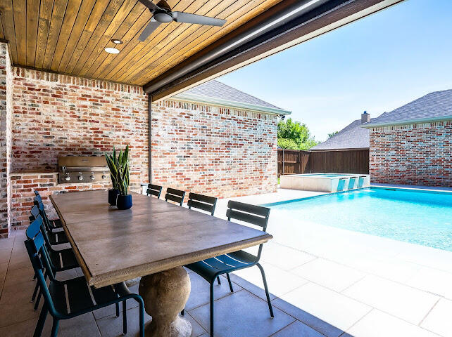 4805 116th Street Lubbock, TX 79424 - Photo 48 of 57 a view of a dining table and chairs in the patio