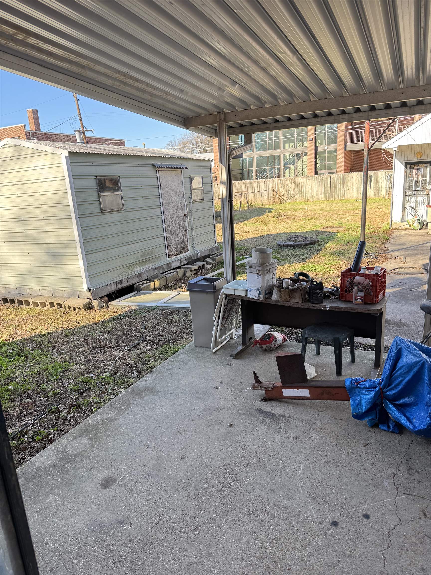 4112 Vaughn Road Memphis, TN 38122 - Photo 12 of 12 a view of a patio with table and chairs under an umbrella