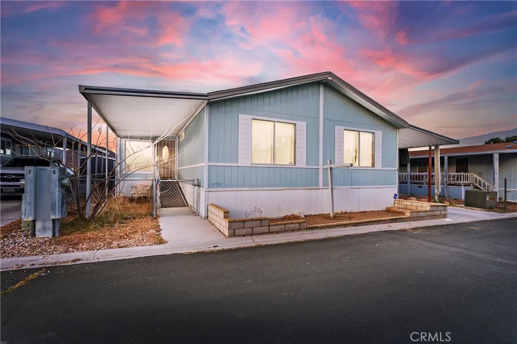 20843 Waalew Road, Unit C6 Apple Valley, CA 92307 - Photo 1 of 1 a front view of a house with a yard