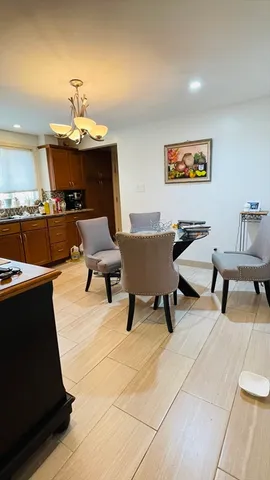 a living room with furniture and a lamp