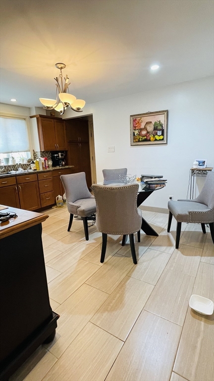 70 Putnam Road, Unit 1 Somerville, MA 02145 - Photo 2 of 11 a living room with furniture and a lamp