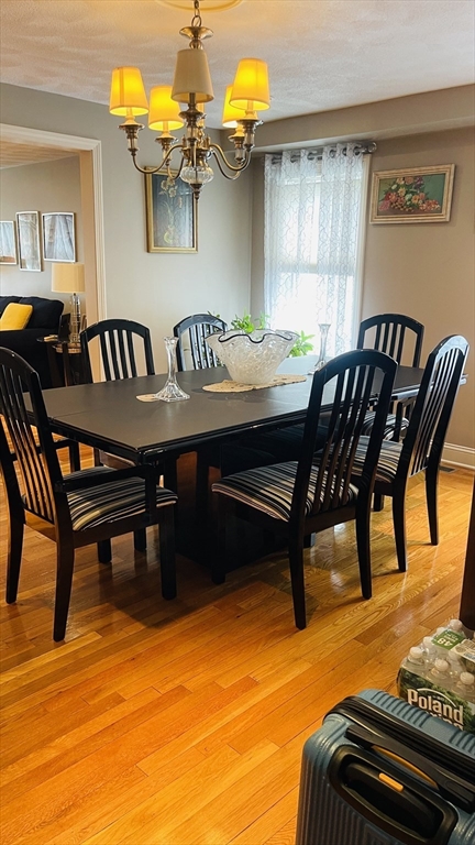 70 Putnam Road, Unit 1 Somerville, MA 02145 - Photo 4 of 11 a view of a dining room with furniture and a table