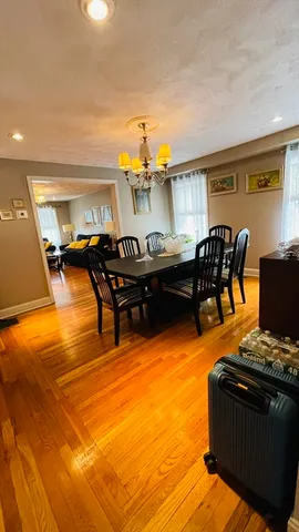 a living room with furniture pool table and a fireplace