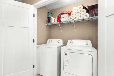 a utility room with dryer and washer