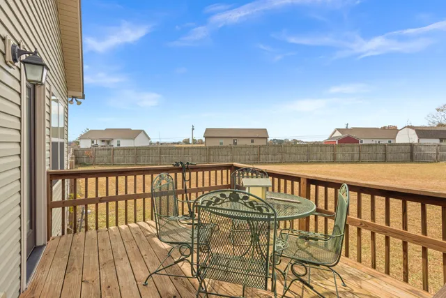 a view of a balcony with wooden floor and city view