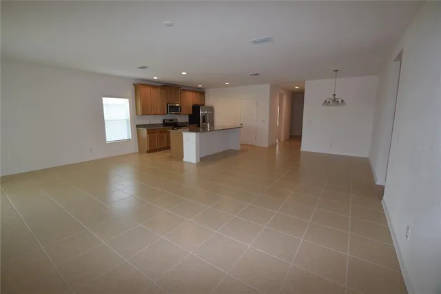 a view of kitchen with appliances and cabinets