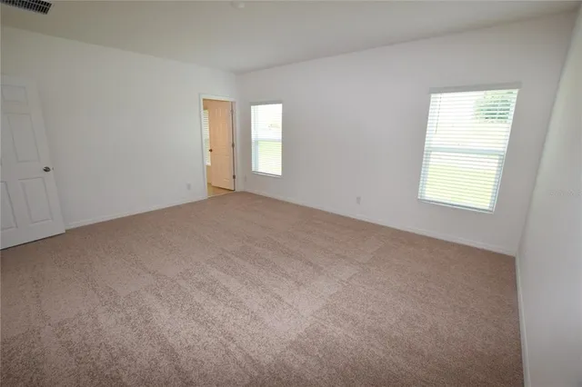 an empty room with windows