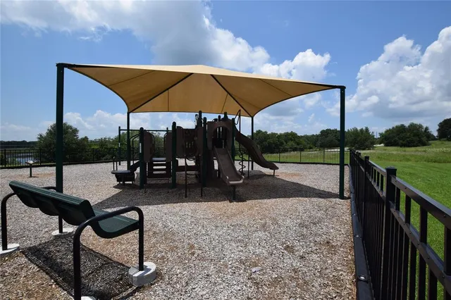 a view of swimming pool with sitting area