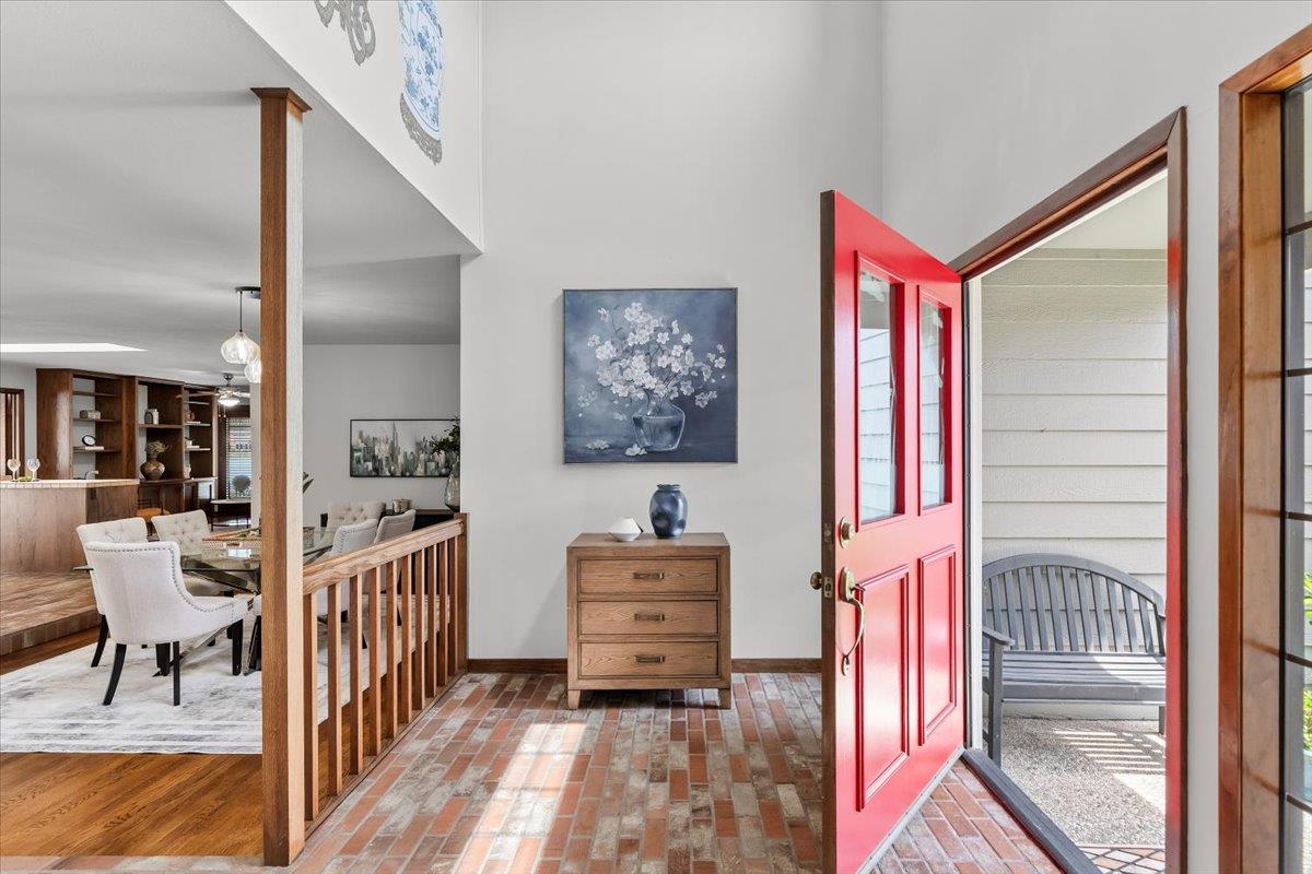 5726 Shelldrake Court Stockton, CA 95207 - Photo 12 of 89 a view of a hallway to a livingroom with wooden floor and furniture