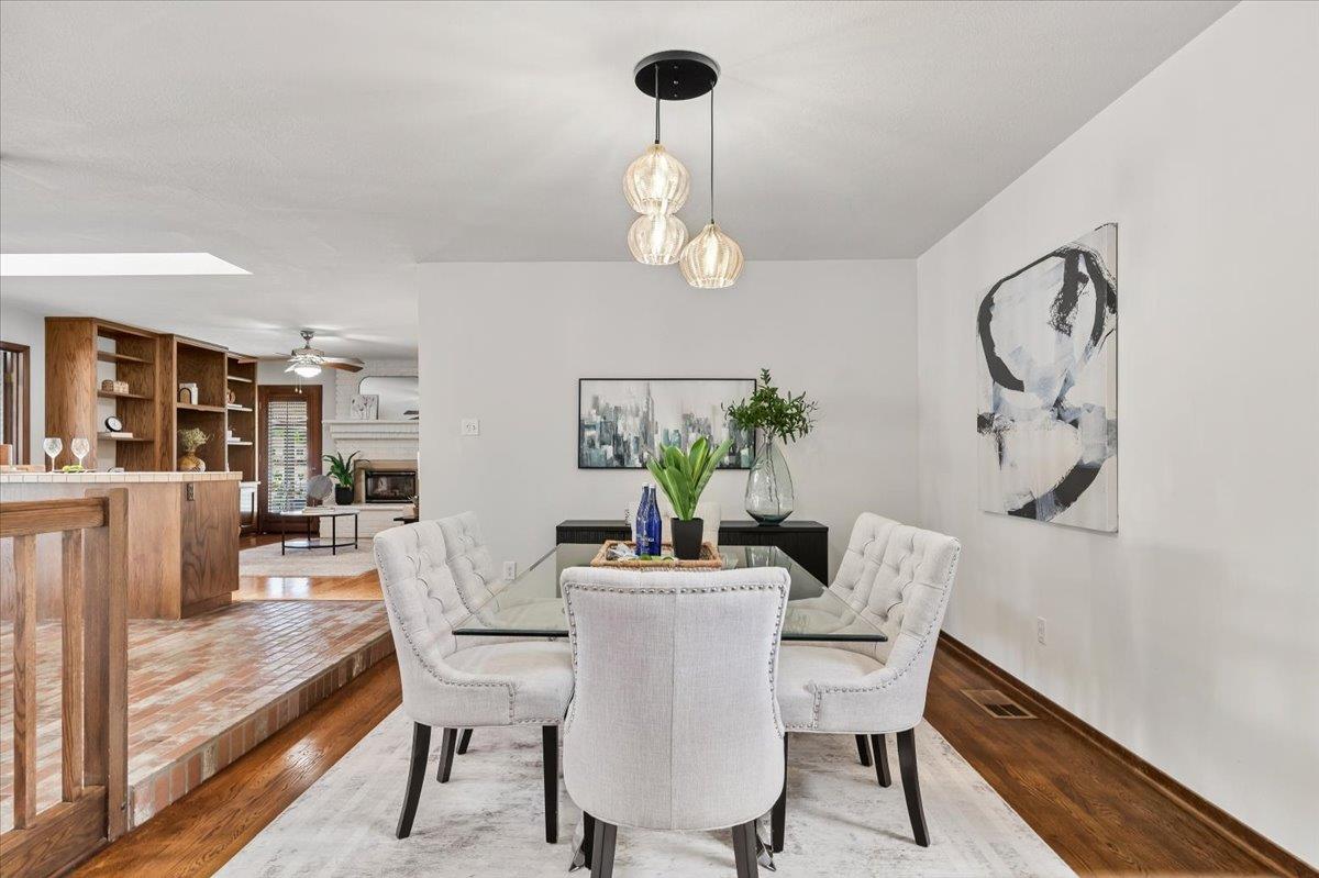5726 Shelldrake Court Stockton, CA 95207 - Photo 15 of 89 a dining room with furniture a rug and wooden floor