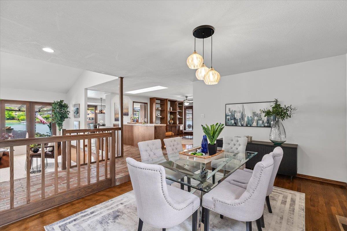 5726 Shelldrake Court Stockton, CA 95207 - Photo 18 of 89 a view of a dining room with furniture wooden floor and chandelier