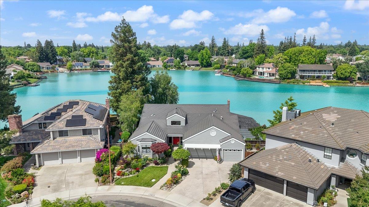 5726 Shelldrake Court Stockton, CA 95207 - Photo 3 of 89 an aerial view of a house with garden space and lake view