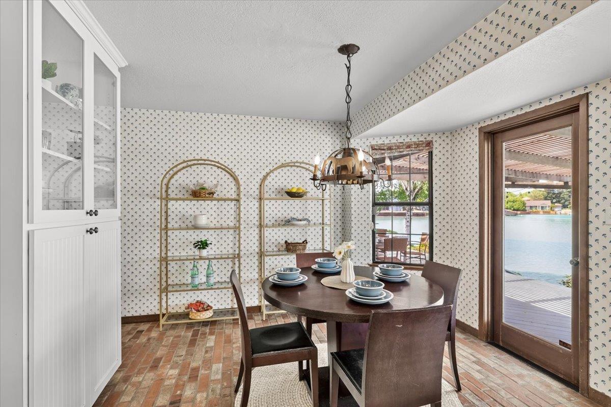 5726 Shelldrake Court Stockton, CA 95207 - Photo 40 of 89 a view of a dining room with furniture window and wooden floor