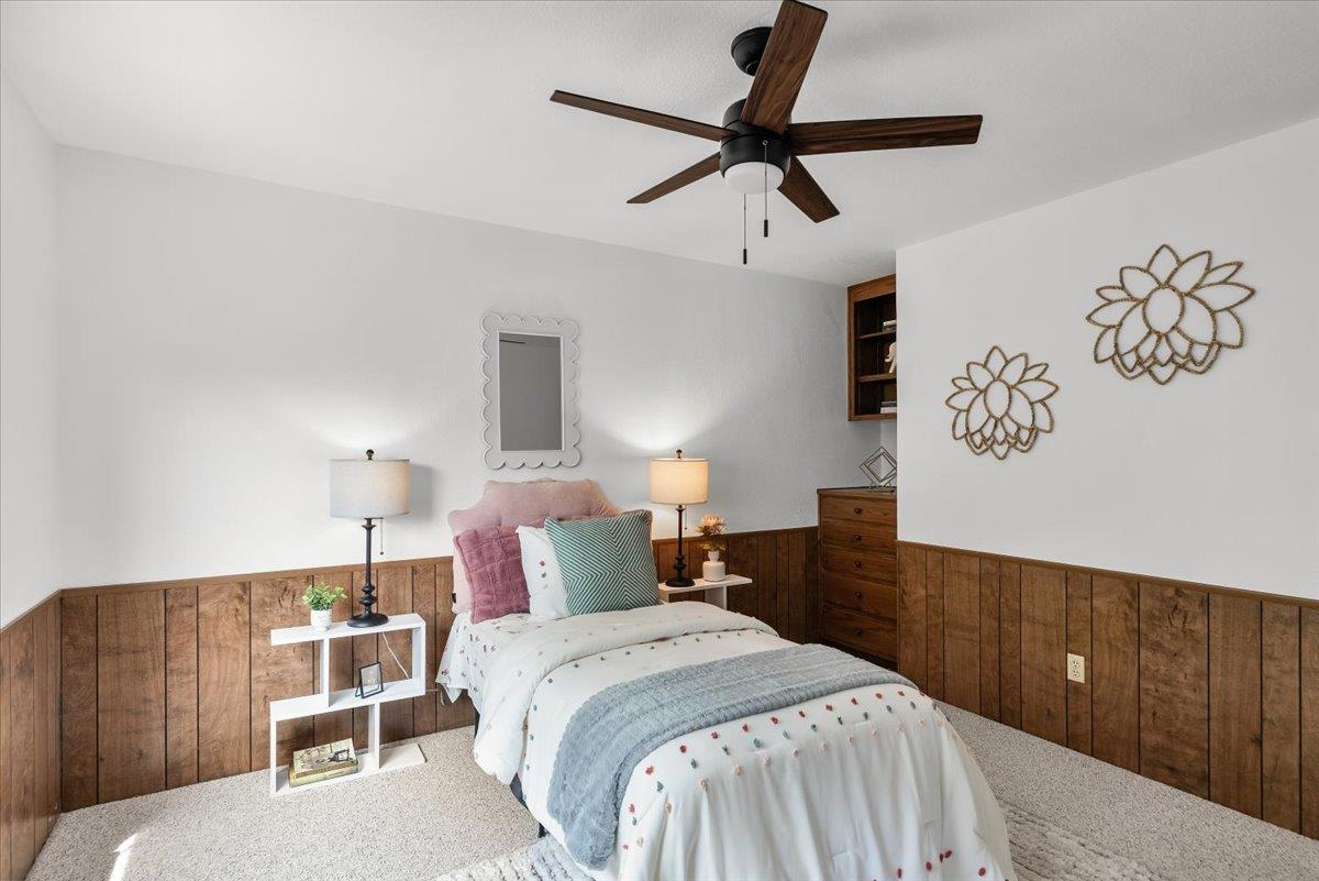5726 Shelldrake Court Stockton, CA 95207 - Photo 70 of 89 a bedroom with a large bed and a chandelier