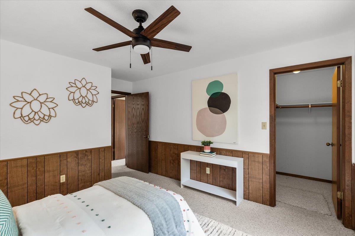 5726 Shelldrake Court Stockton, CA 95207 - Photo 71 of 89 a bedroom with a bed and a chandelier
