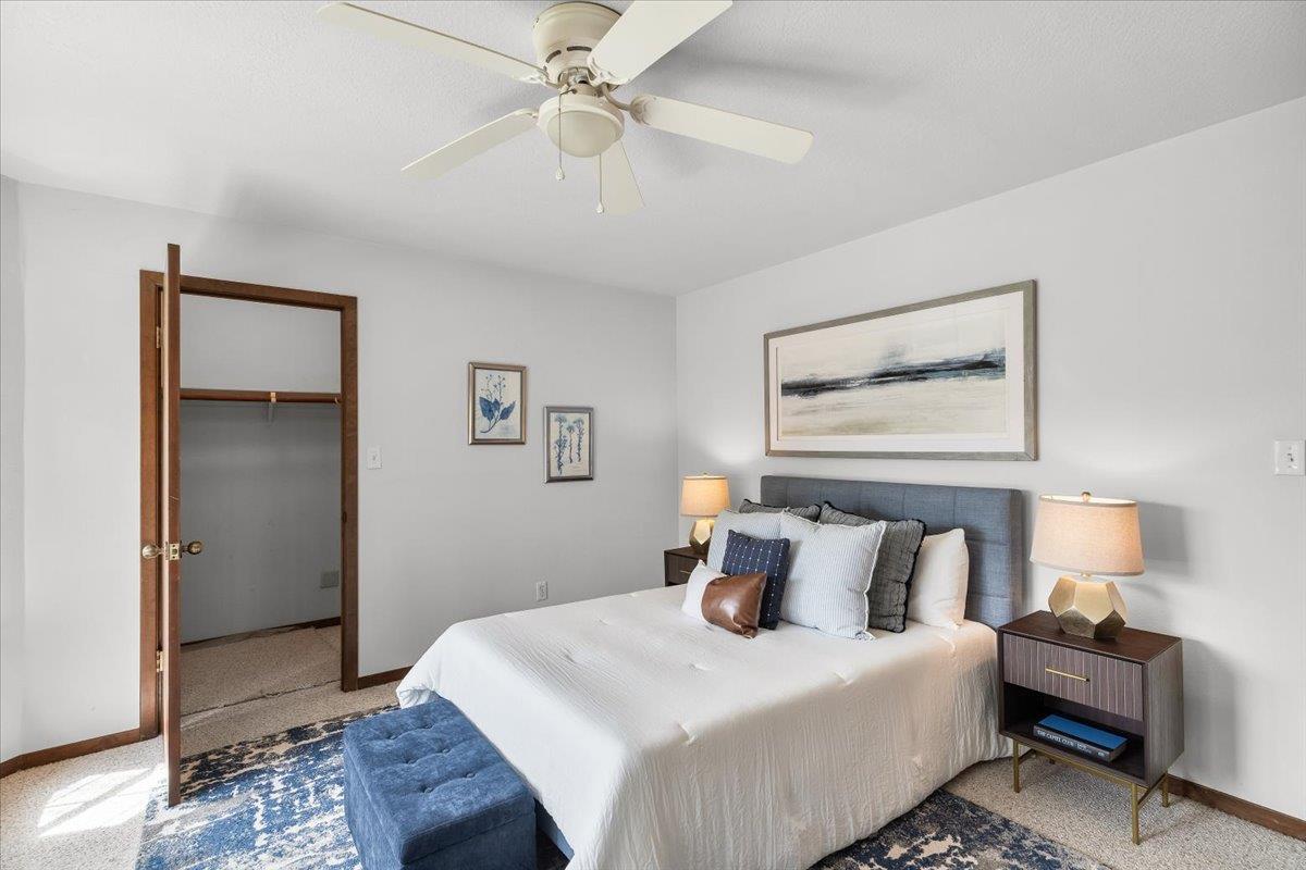 5726 Shelldrake Court Stockton, CA 95207 - Photo 73 of 89 a bedroom with a bed and a chandelier