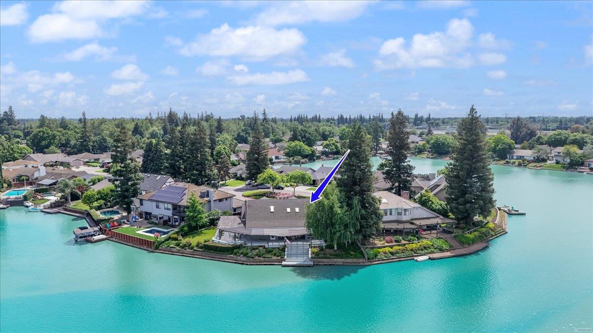 5726 Shelldrake Court Stockton, CA 95207 - Photo 89 of 89 an aerial view of a house with a garden and lake view