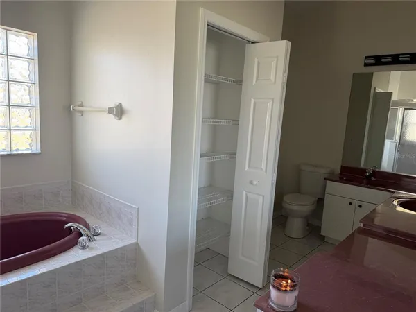a bathroom with a tub and a sink