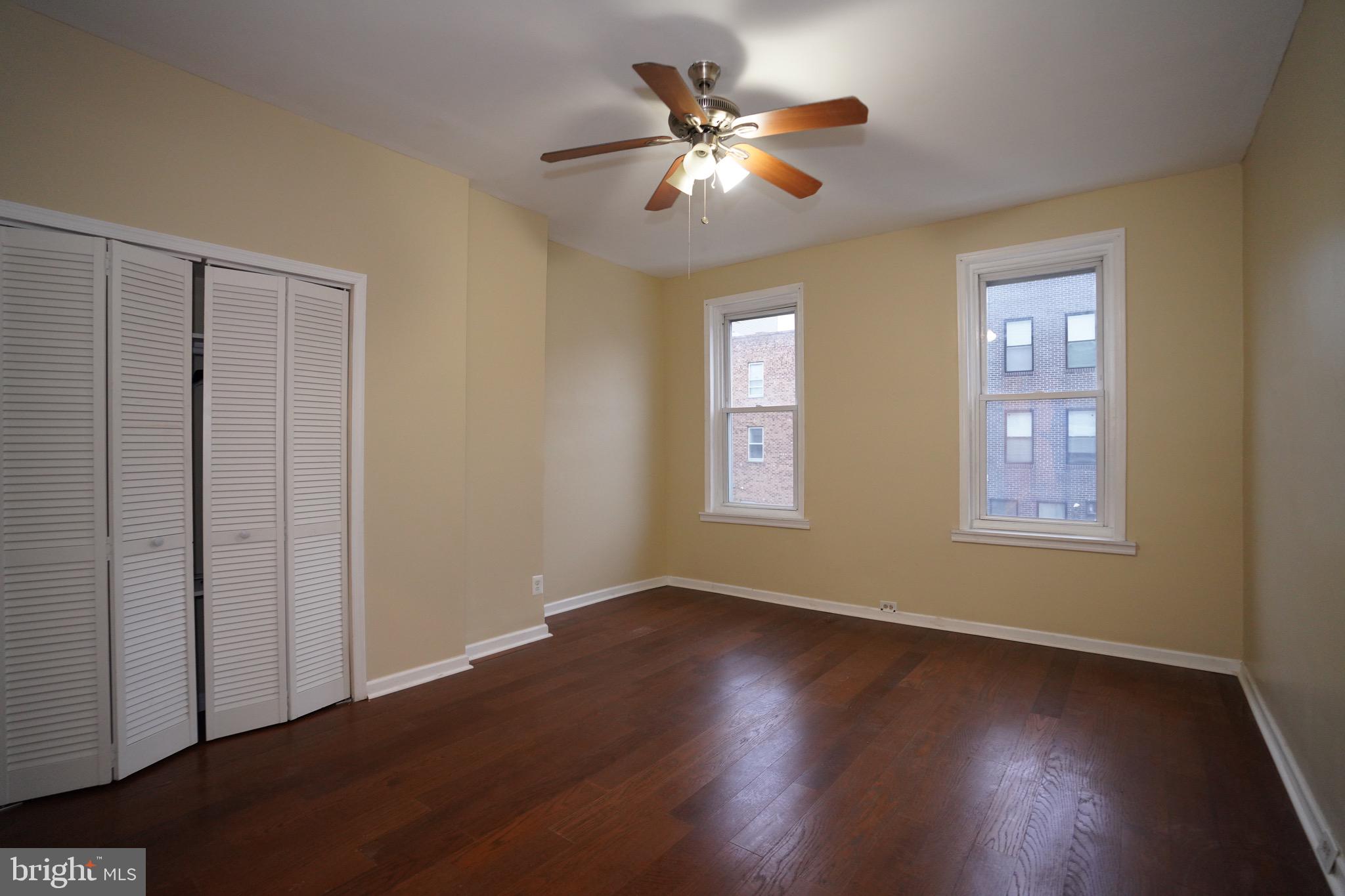 2512 North Front Street Philadelphia, PA 19133 - Photo 11 of 33 a view of an empty room with wooden floor and a window