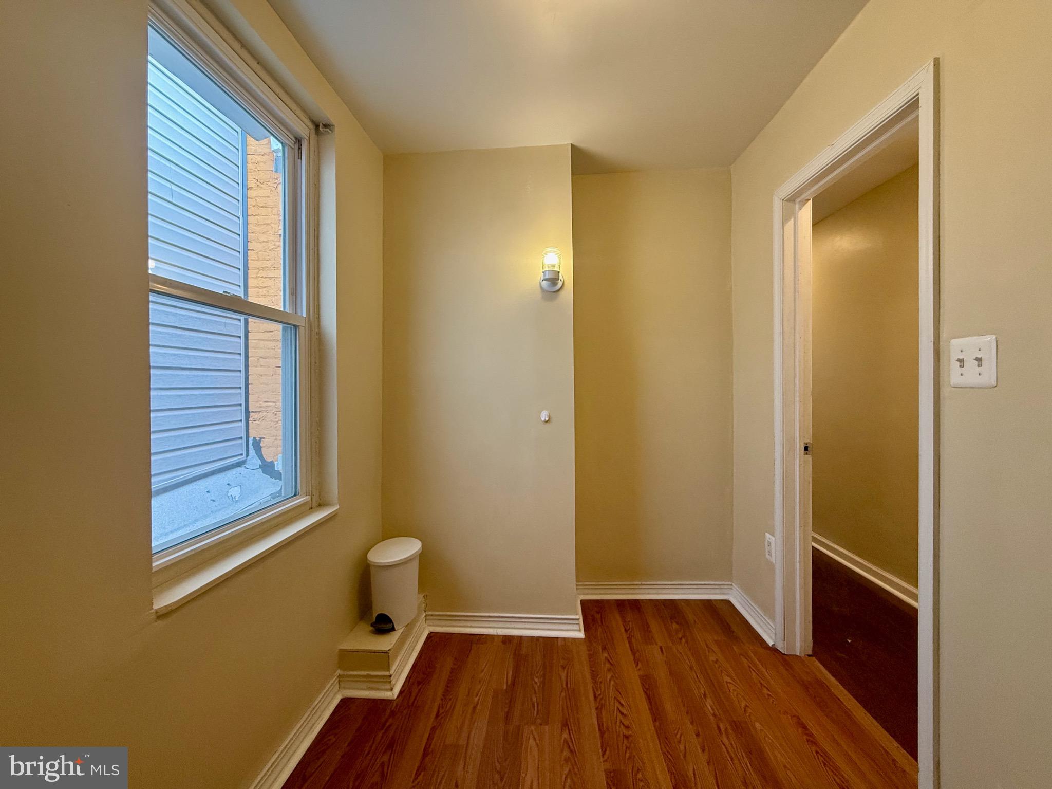 2512 North Front Street Philadelphia, PA 19133 - Photo 15 of 33 a view of a room with wooden floor and a window