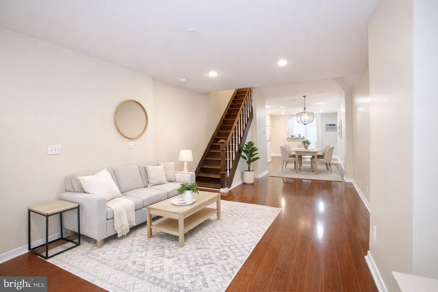 2512 North Front Street Philadelphia, PA 19133 - Photo 2 of 33 a living room with furniture and stairs with wooden floor