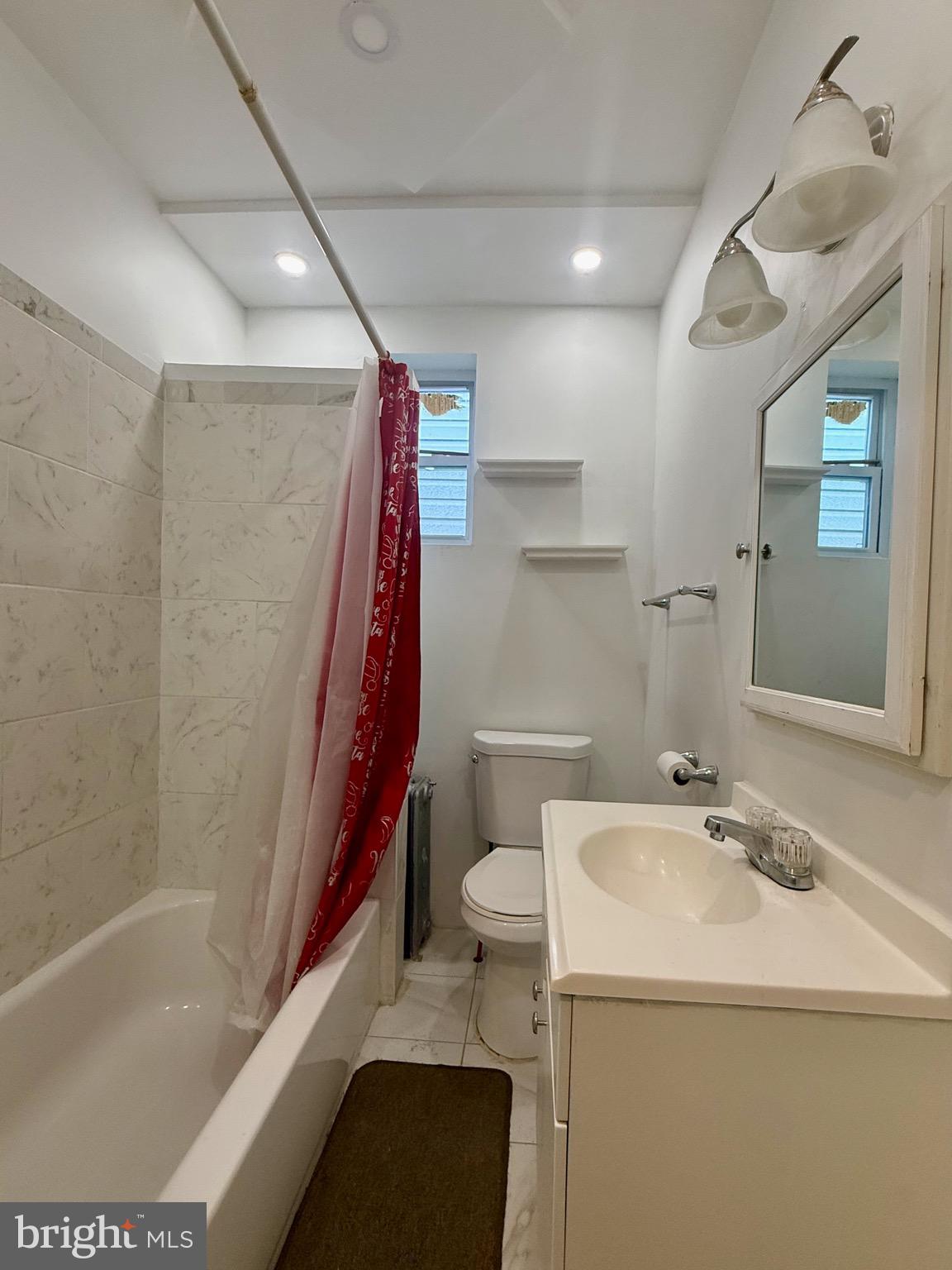 2512 North Front Street Philadelphia, PA 19133 - Photo 21 of 33 a bathroom with a sink a toilet and shower