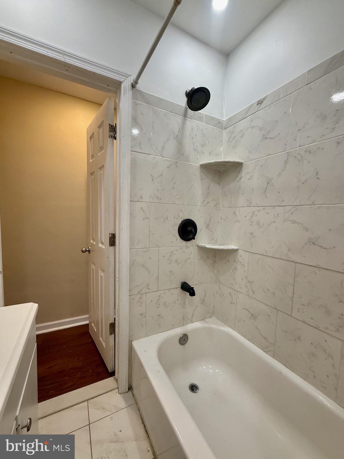 2512 North Front Street Philadelphia, PA 19133 - Photo 22 of 33 a bathroom with a bathtub and a shower