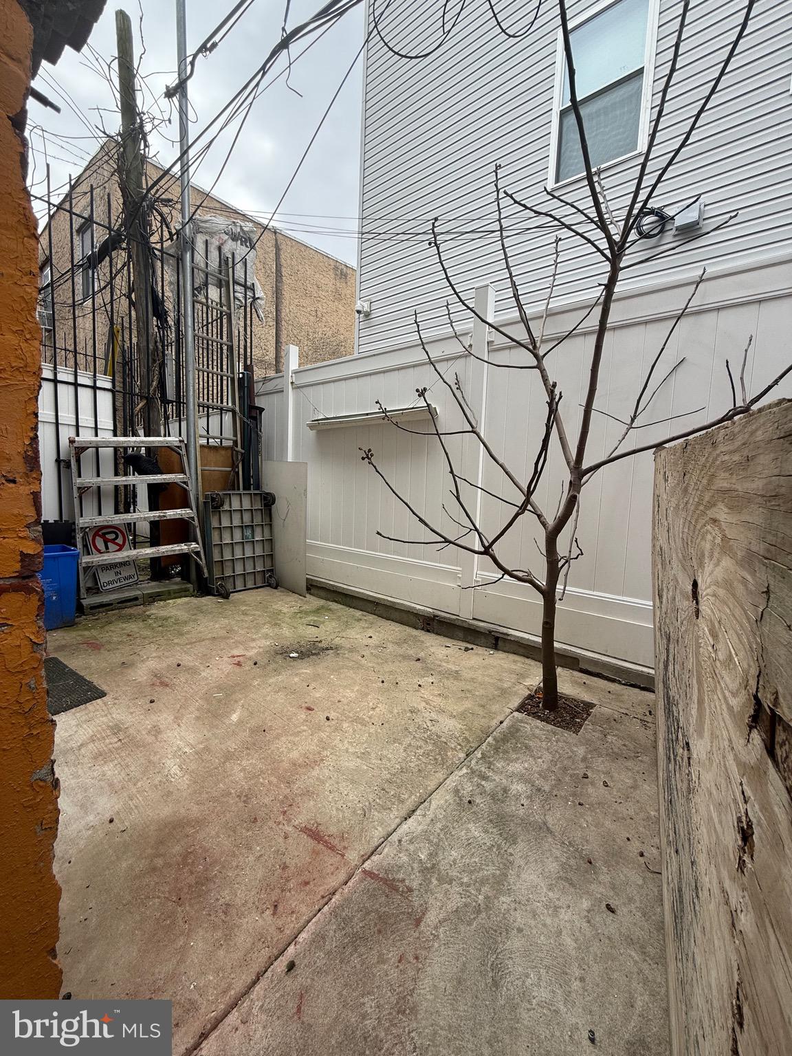 2512 North Front Street Philadelphia, PA 19133 - Photo 5 of 33 a view of a garage with wooden fence